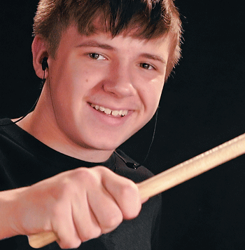 Photo of Avery drumming